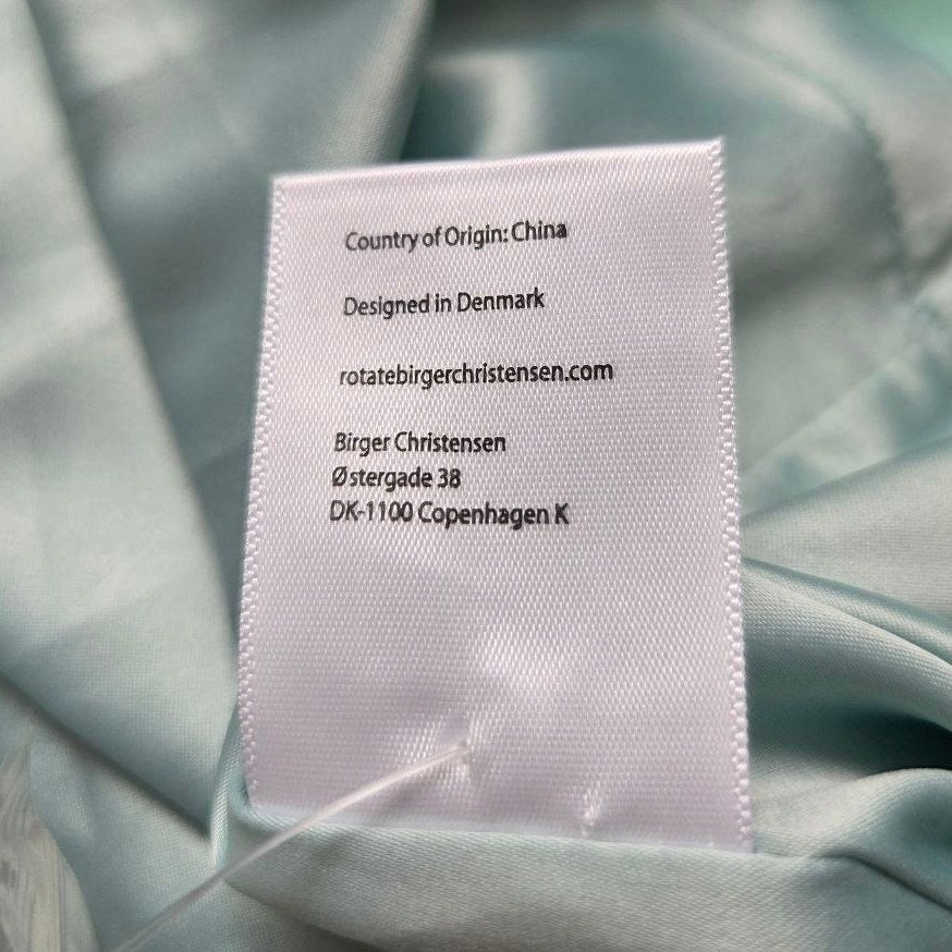 Country-of-origin label of ROTATE Morning Mist aqua mini dress