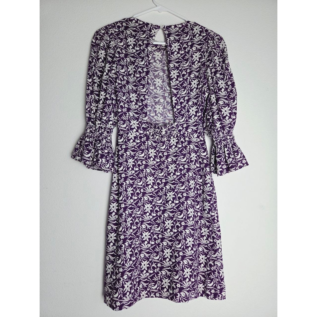 Back view on hanger of Maje Roniriqua purple floral mini dress
