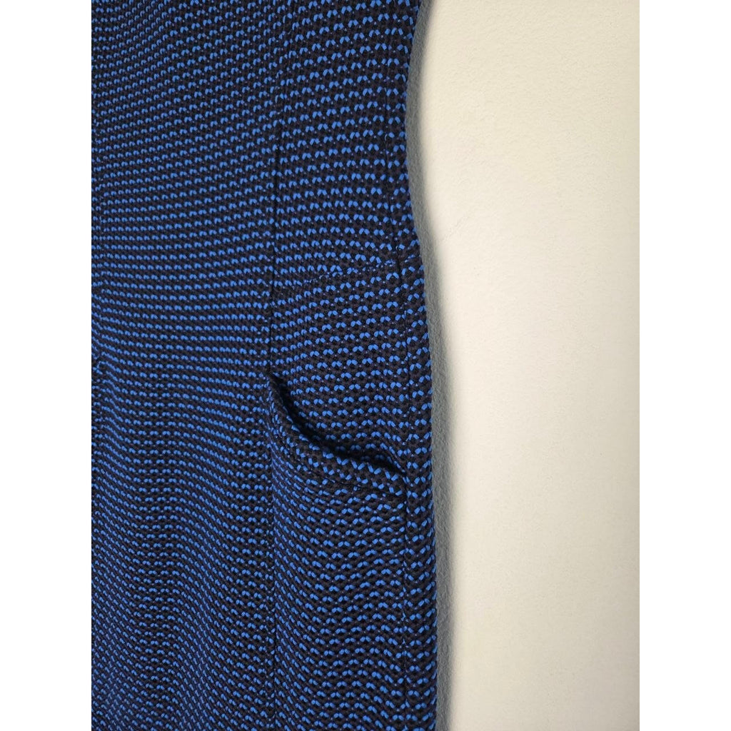 Pocket opening detail of Derek Lam blue and black sheath dress