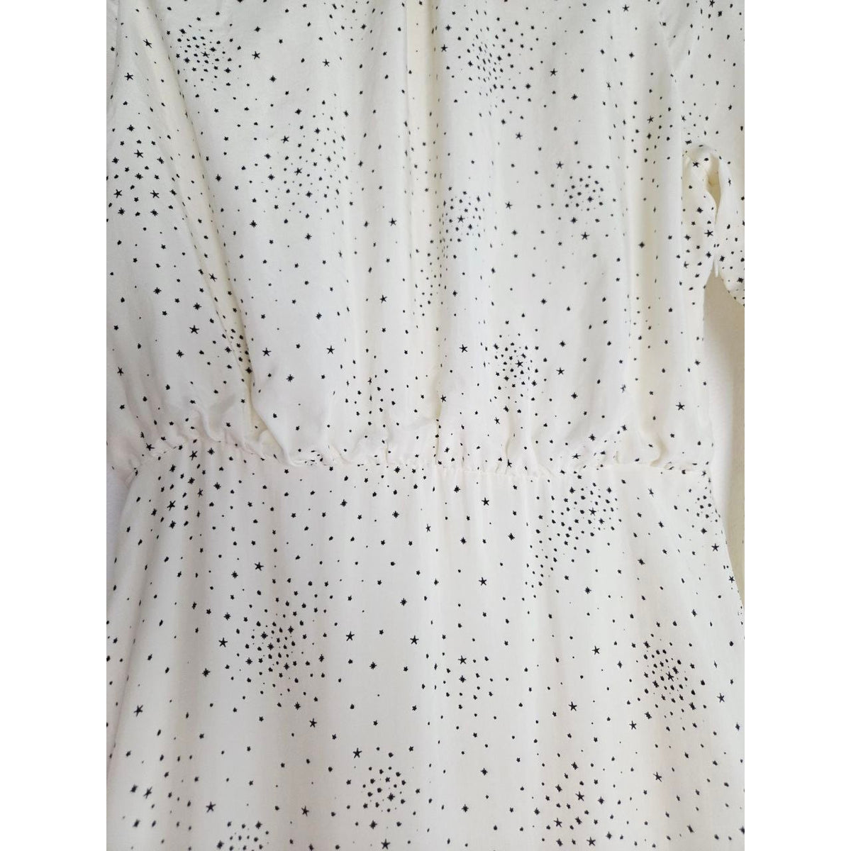 Defined waist detail of Maje Reto ecru star-print dress