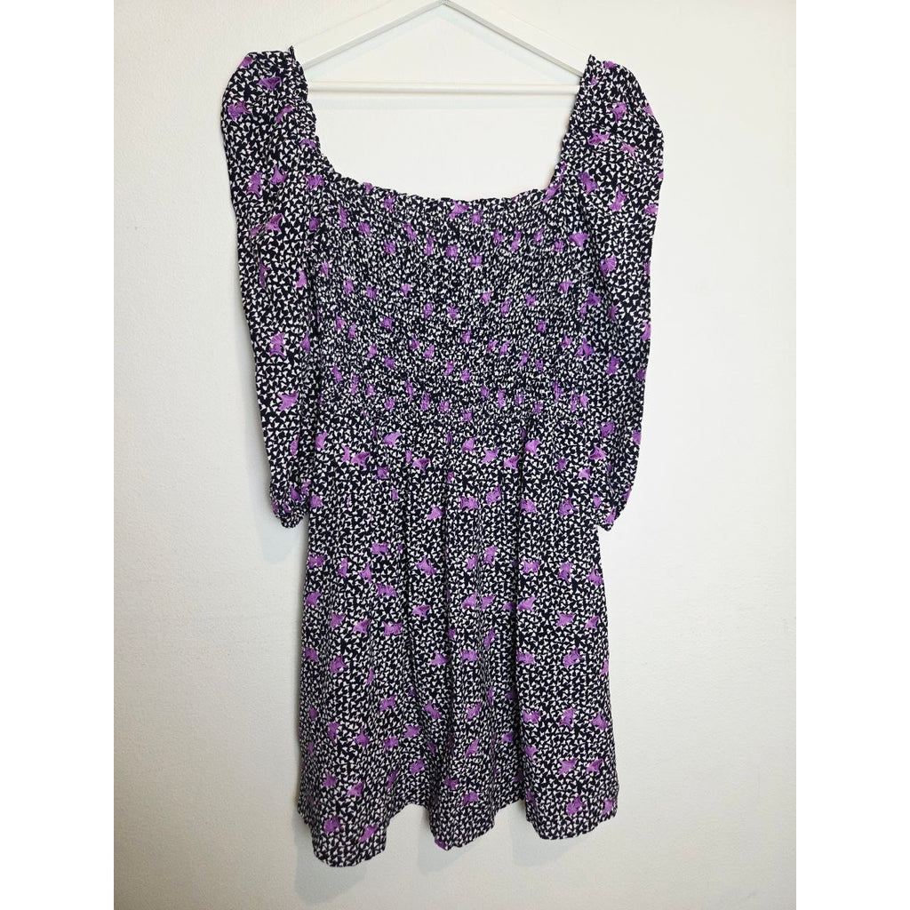 Front view on hanger of Maje Rappa floral smocked mini dress