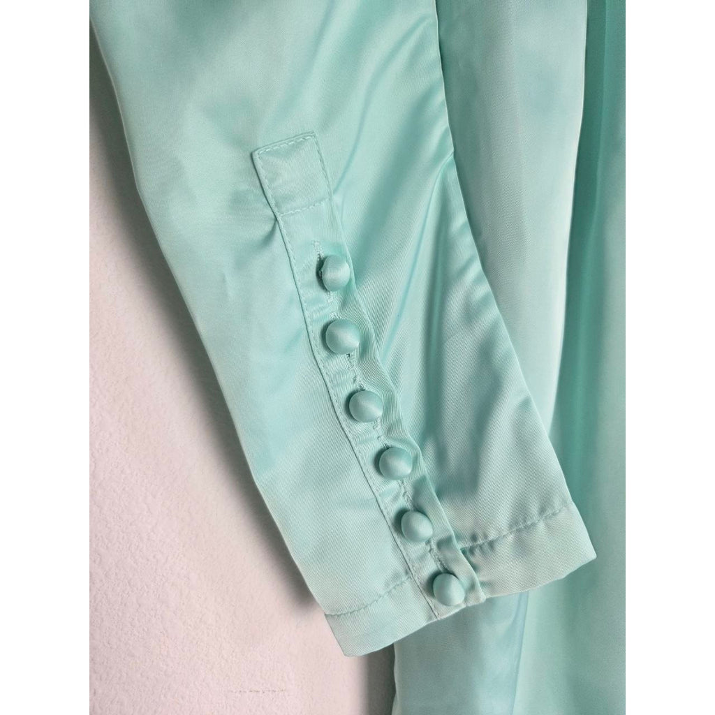 Fabric-covered cuff buttons of ROTATE Morning Mist aqua mini dress