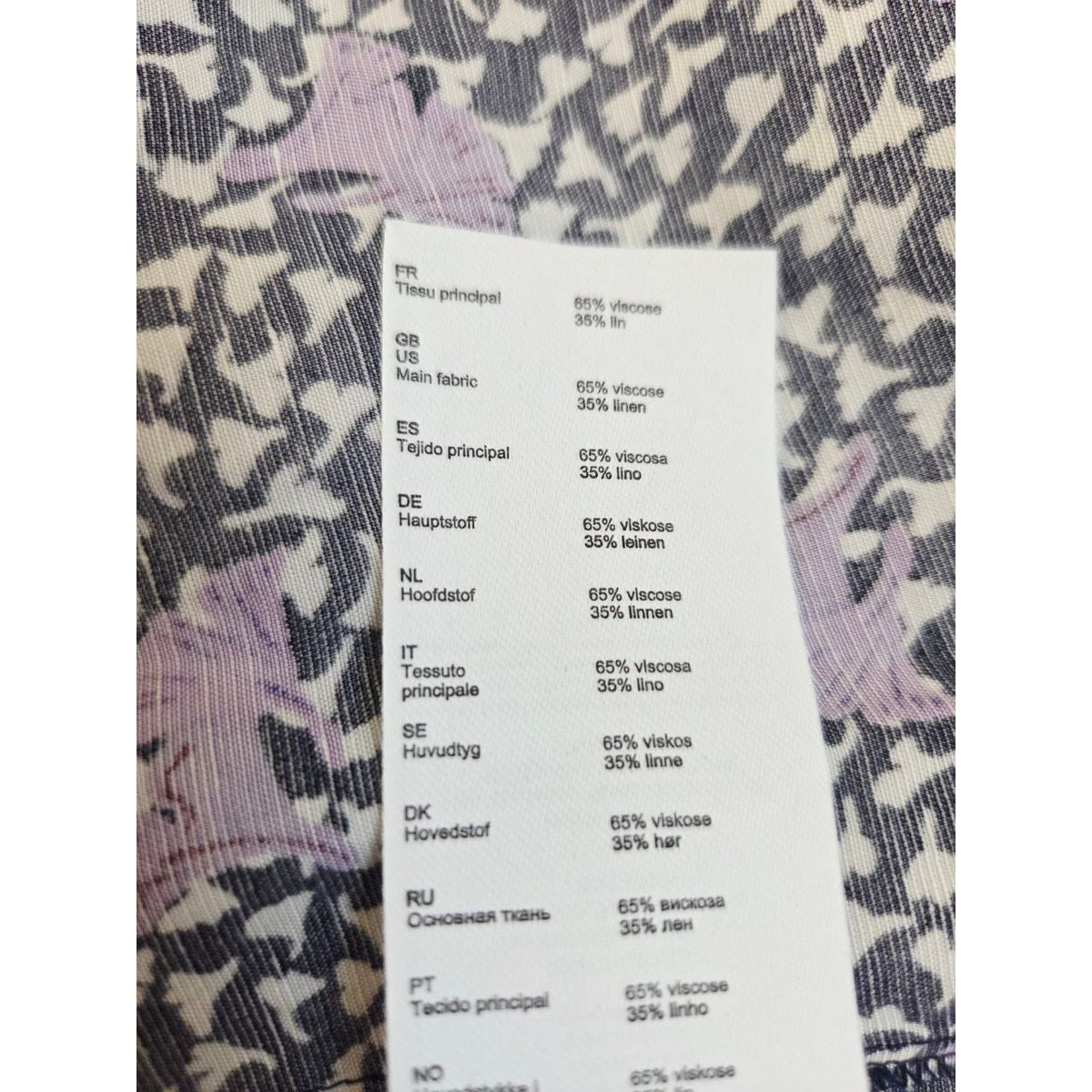 Composition label of Maje Rappa floral smocked mini dress