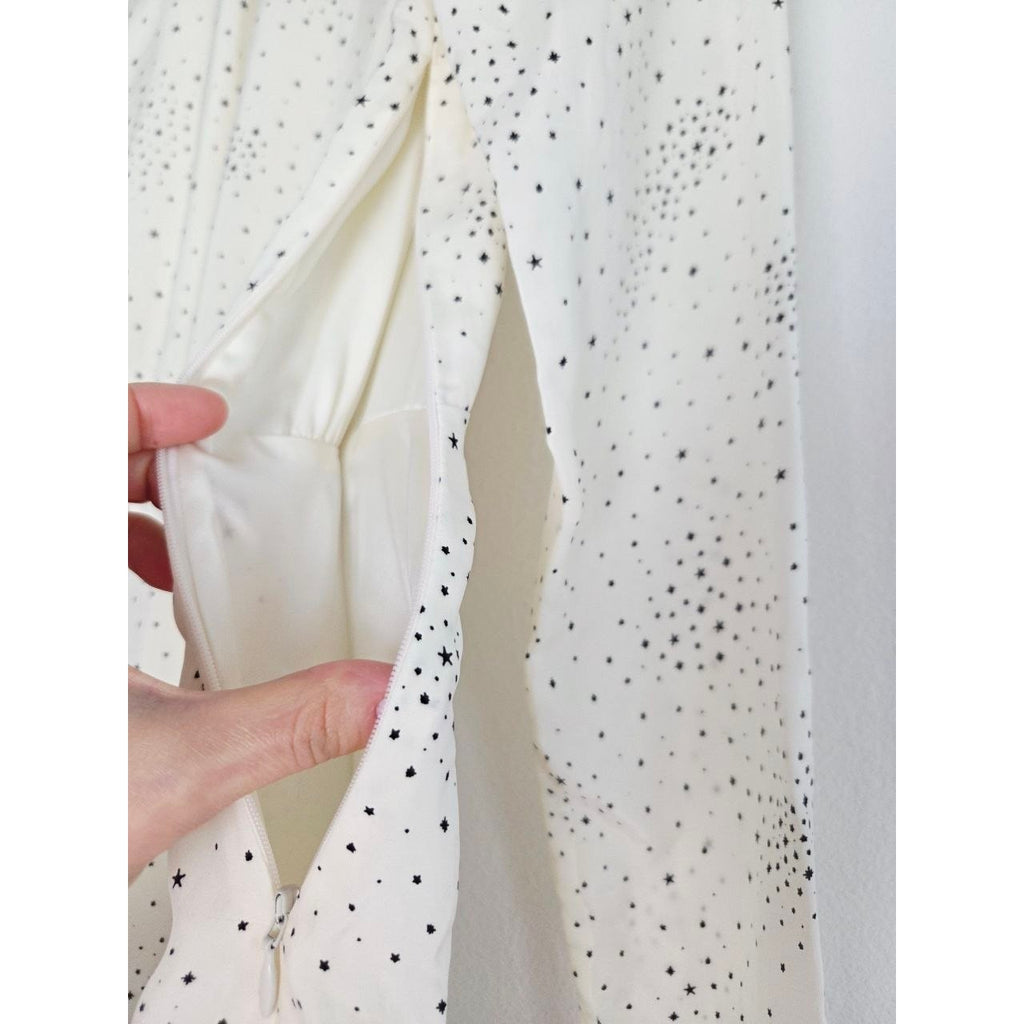 Side opening and lining of Maje Reto ecru star-print dress