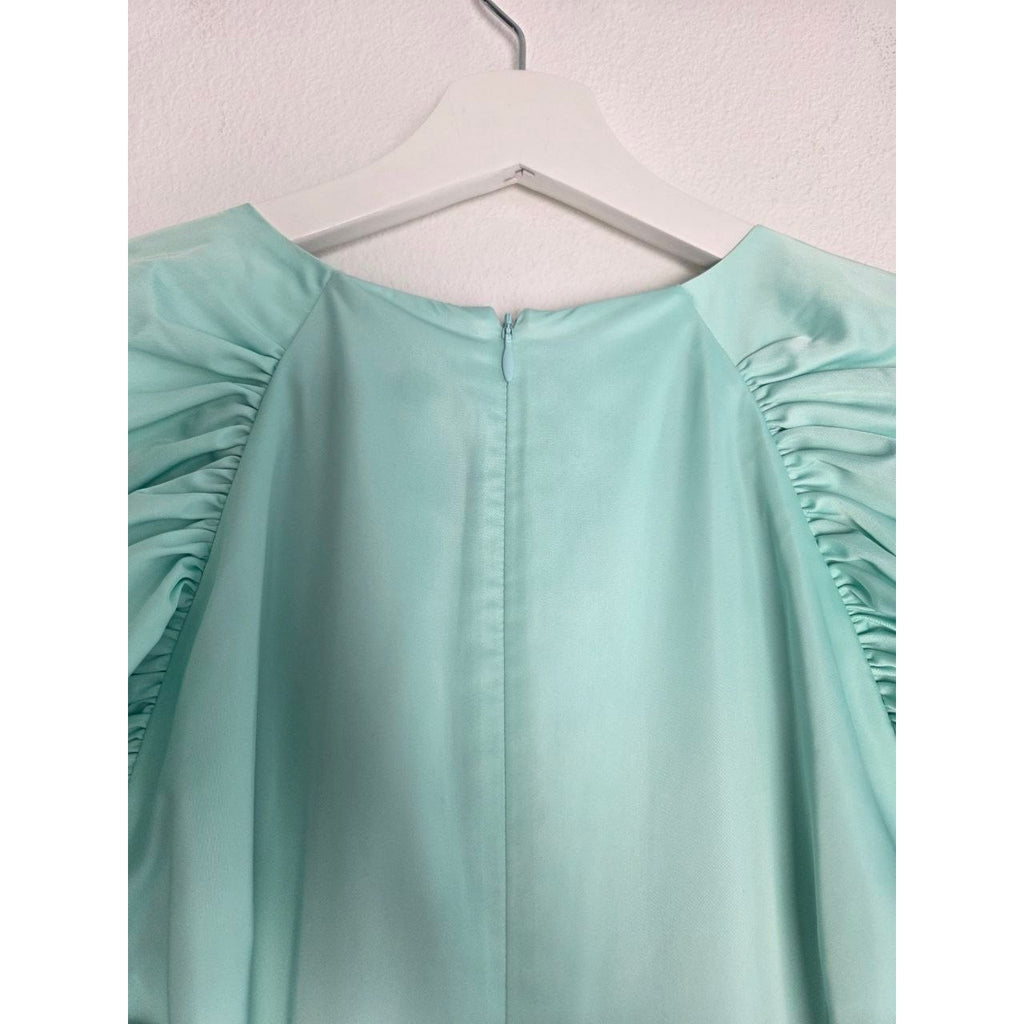 Back neckline and zipper of ROTATE Morning Mist aqua mini dress