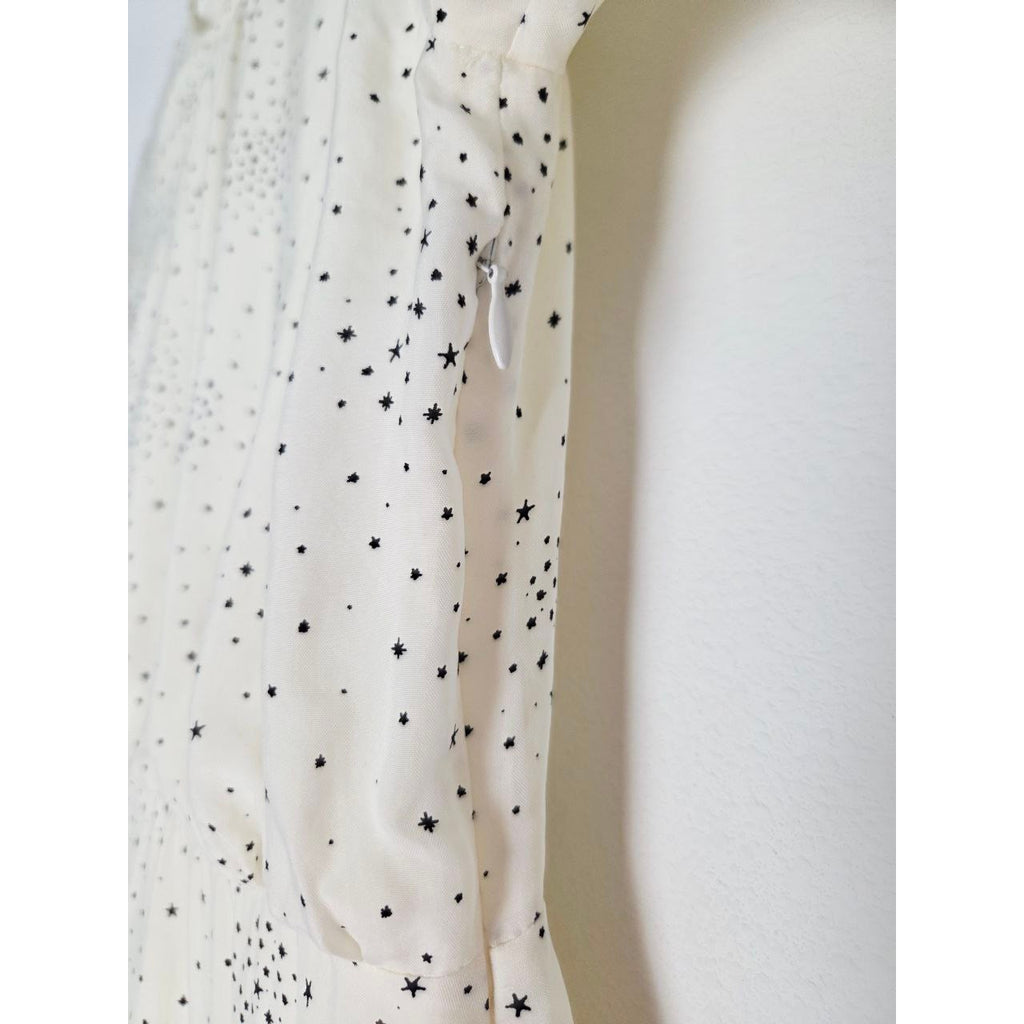 Side zipper close-up of Maje Reto ecru star-print dress