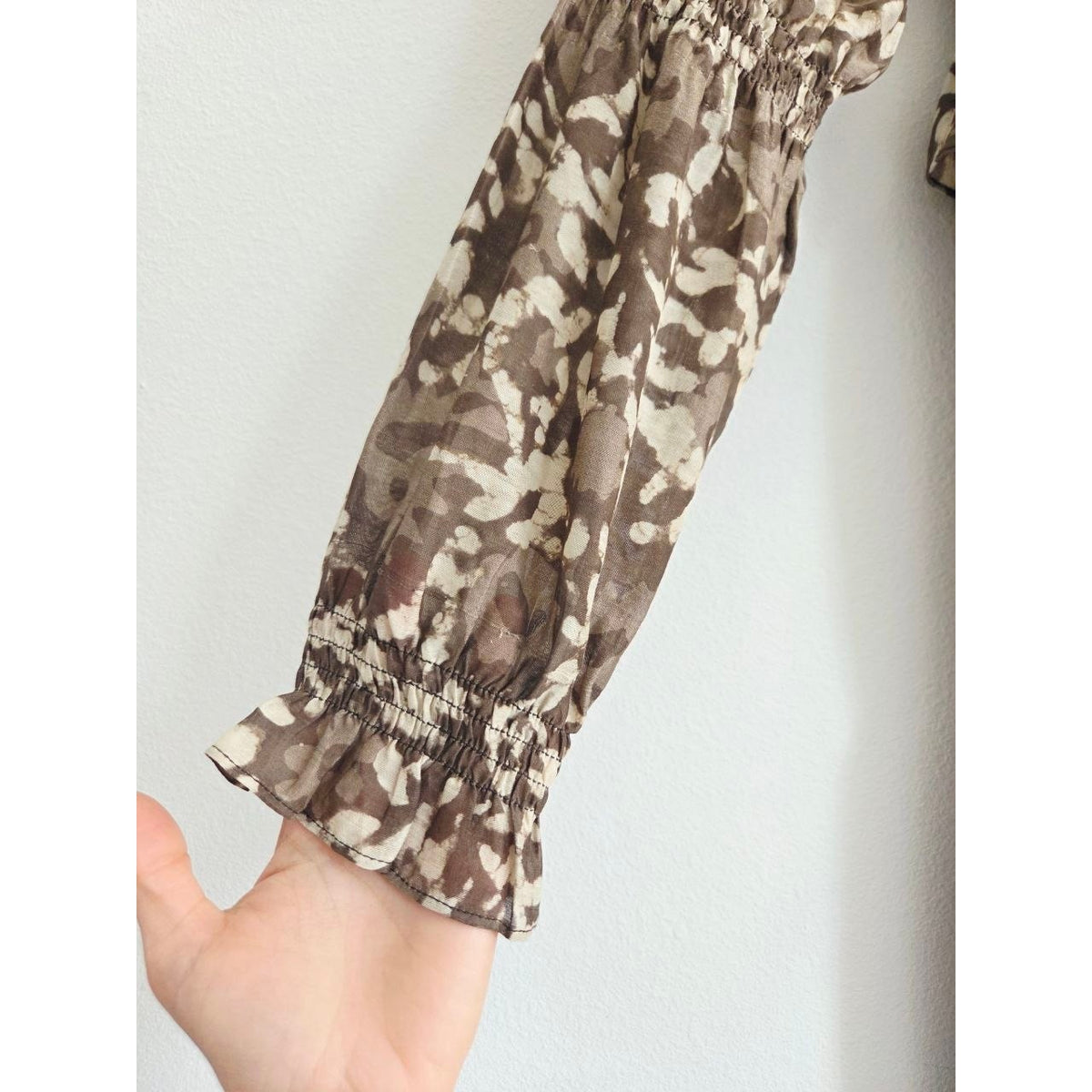 Smocked cuff and sheer sleeve of Frances Hart Maxine floral maternity dress