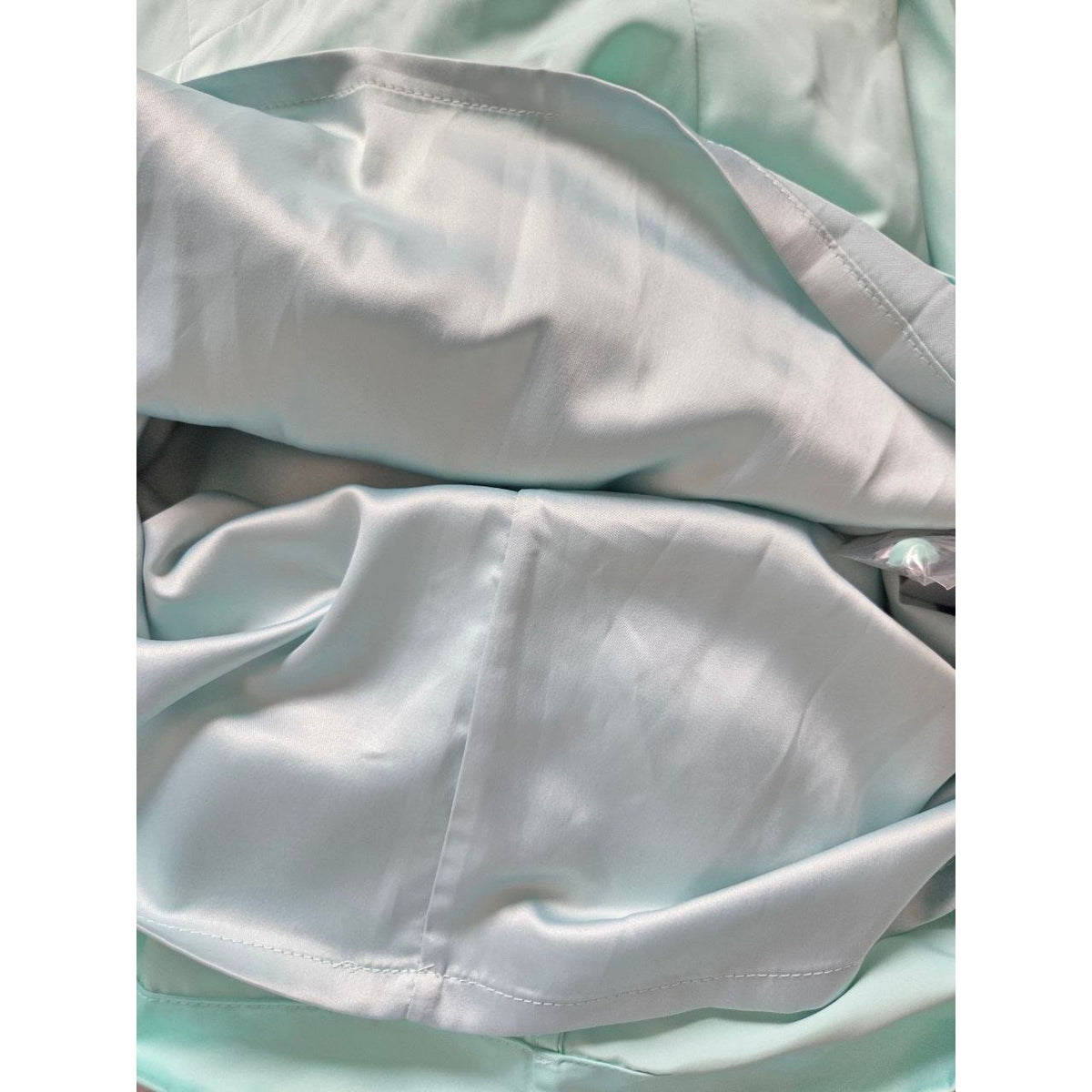 Interior lining of ROTATE Morning Mist aqua mini dress