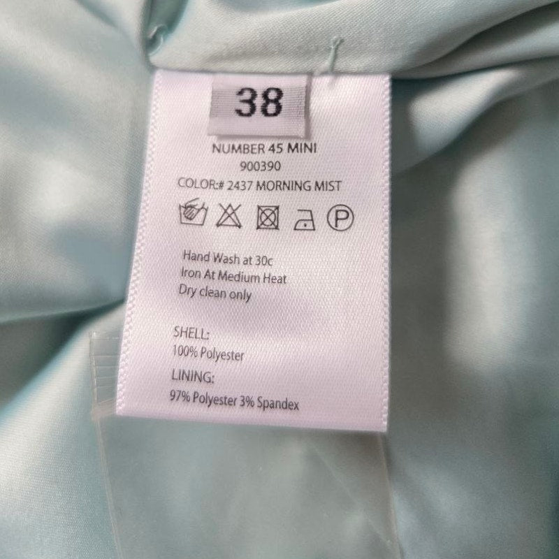Size and composition label of ROTATE Morning Mist aqua mini dress