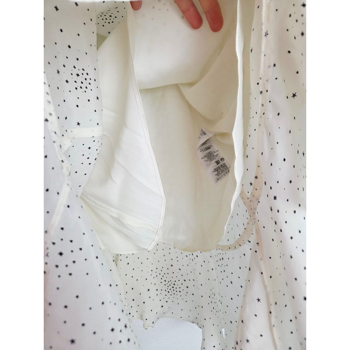 Interior lining of Maje Reto ecru star-print dress