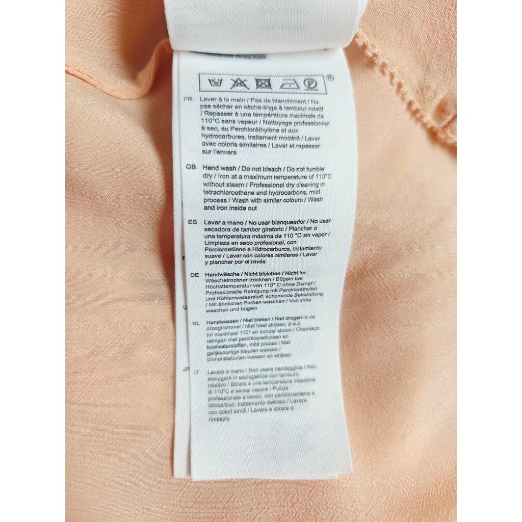 Care instructions label of Maje Riava blush mini dress