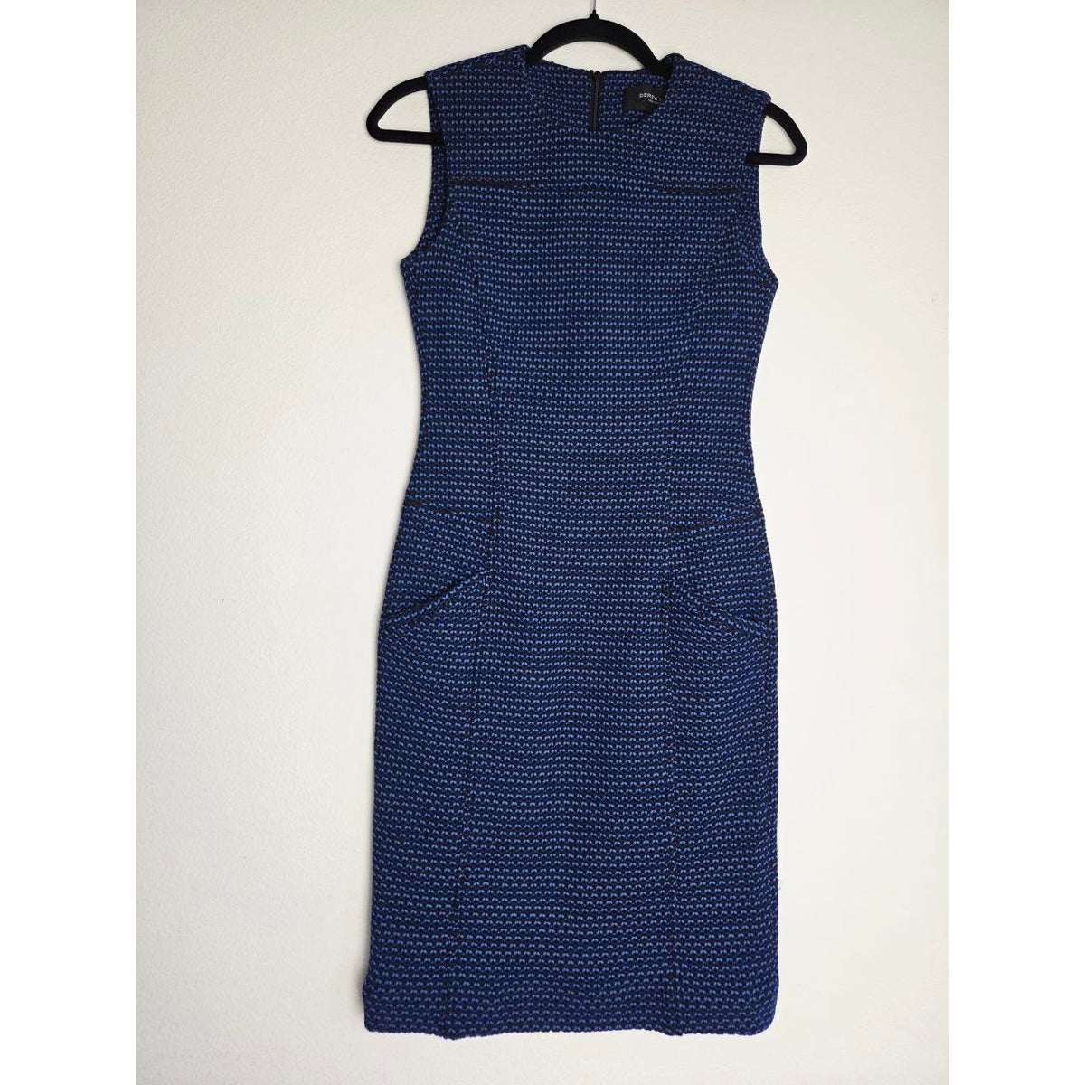 Front view on hanger of Derek Lam blue and black sheath dress