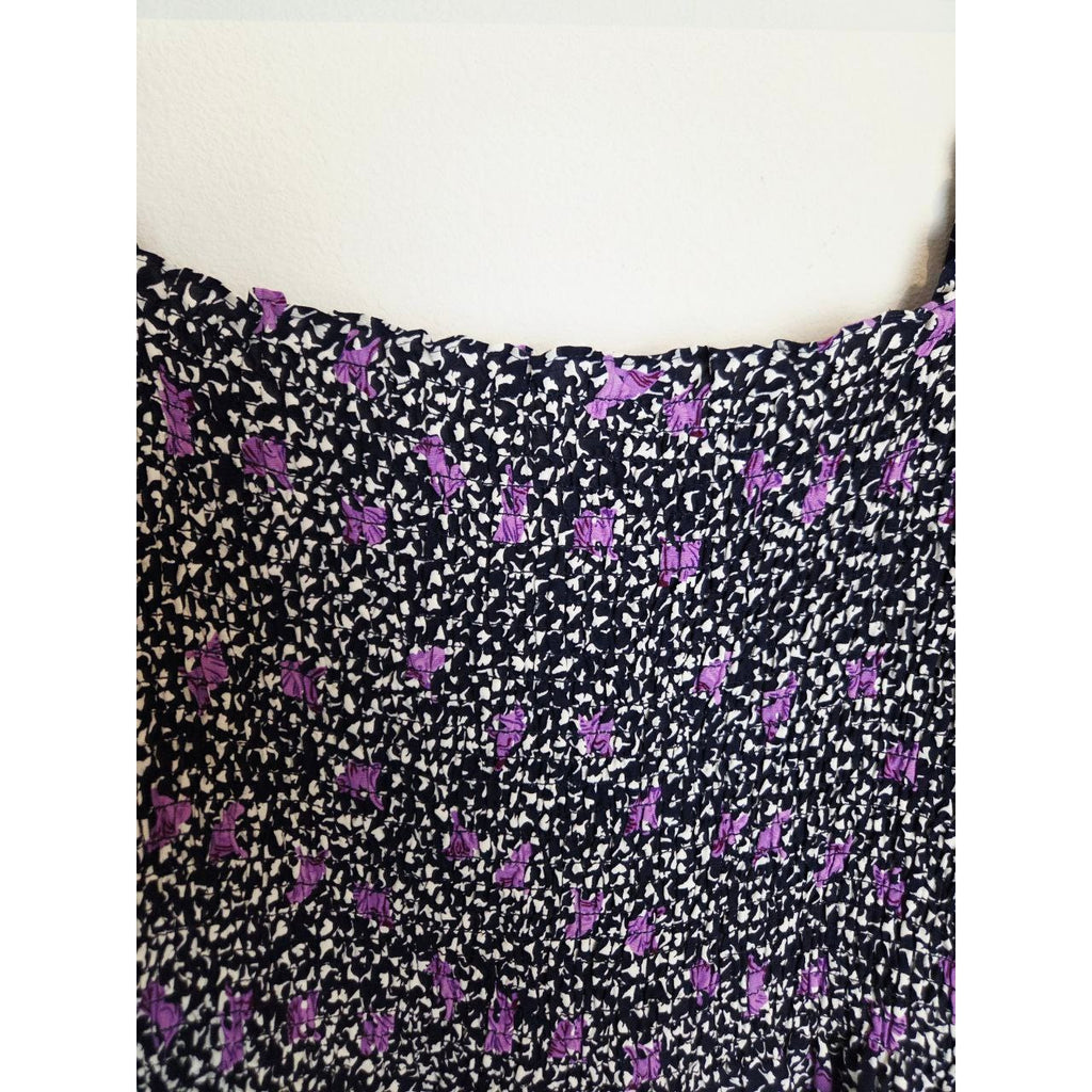 Square neckline and smocking of Maje Rappa floral smocked mini dress