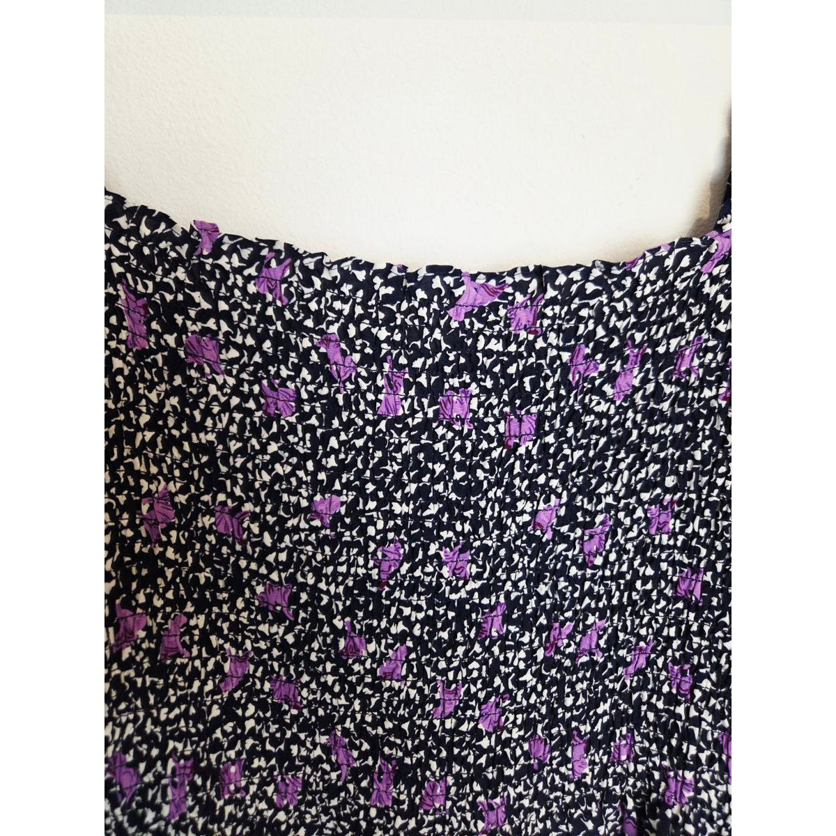 Square neckline and smocking of Maje Rappa floral smocked mini dress