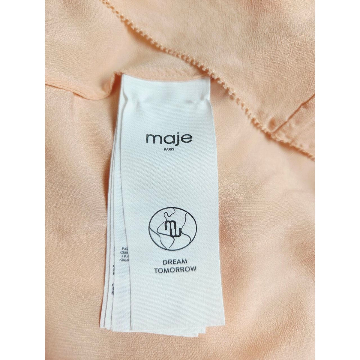 Garment label of Maje Riava blush mini dress