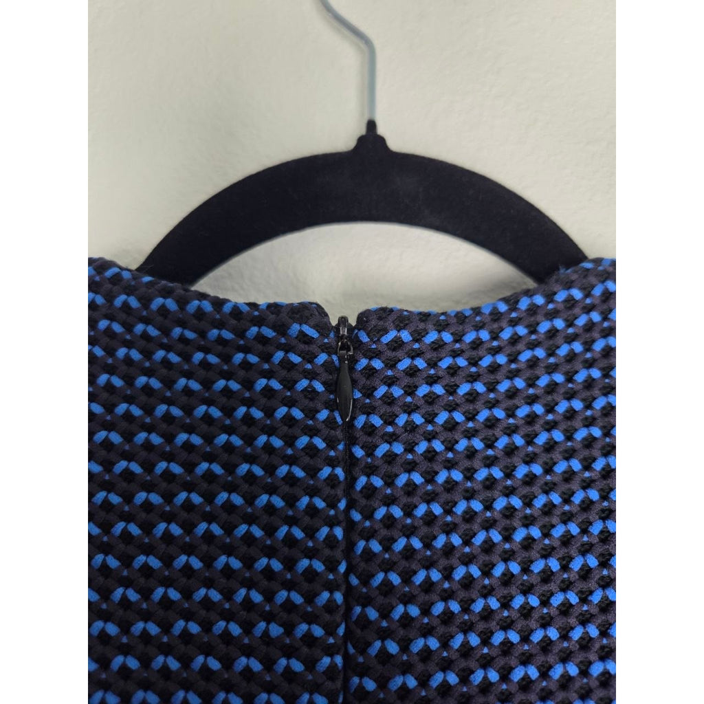 Back neckline and zipper close-up of Derek Lam blue and black sheath dress