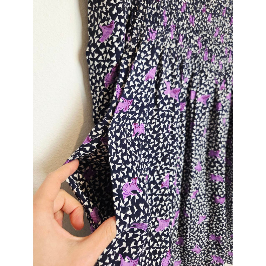 Side pocket of Maje Rappa floral smocked mini dress