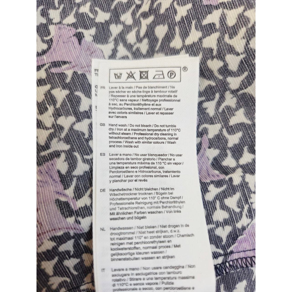 Care label of Maje Rappa floral smocked mini dress