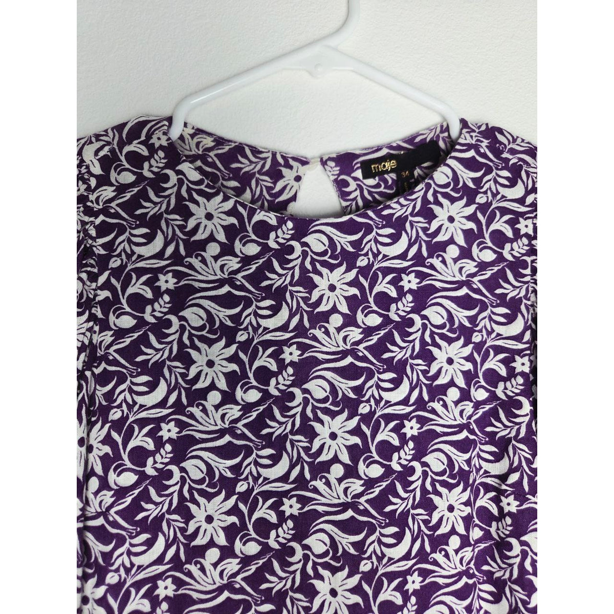 Round neckline detail of Maje Roniriqua purple floral mini dress
