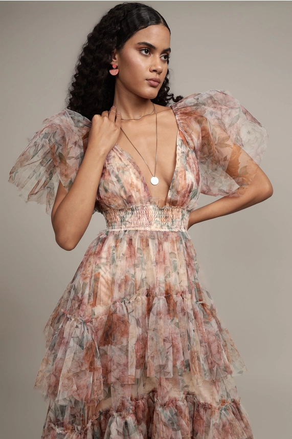 Close-up of Jasmine tulle maxi dress with plunging V neckline, smocked waist and sheer ruffled sleeves