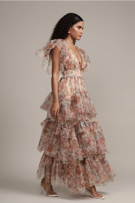 Side profile of Jasmine brown floral stiff tulle dress with voluminous sleeves